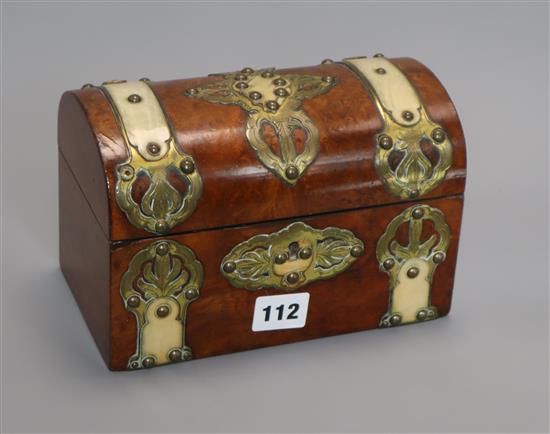 A dome topped horn and brass bound walnut tea caddy length 20cm